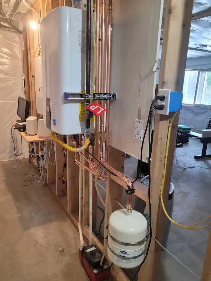 Licensed plumber repairing a kitchen sink in Lanett